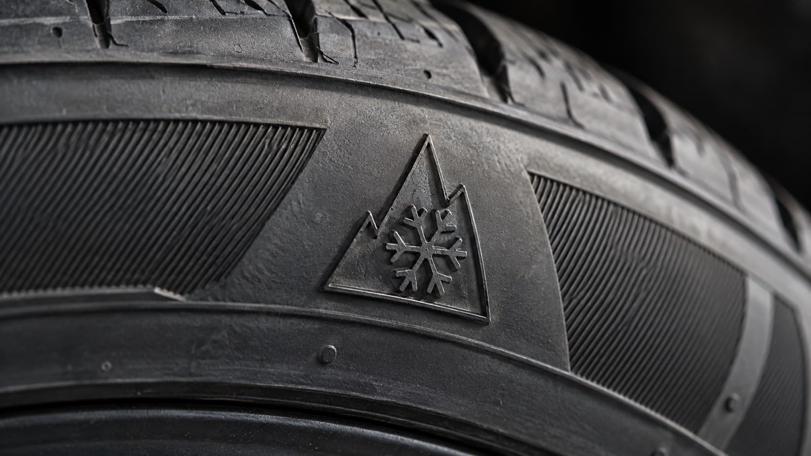 Three-Peak Mountain Snowflake symbol on an all-weather tire sidewall