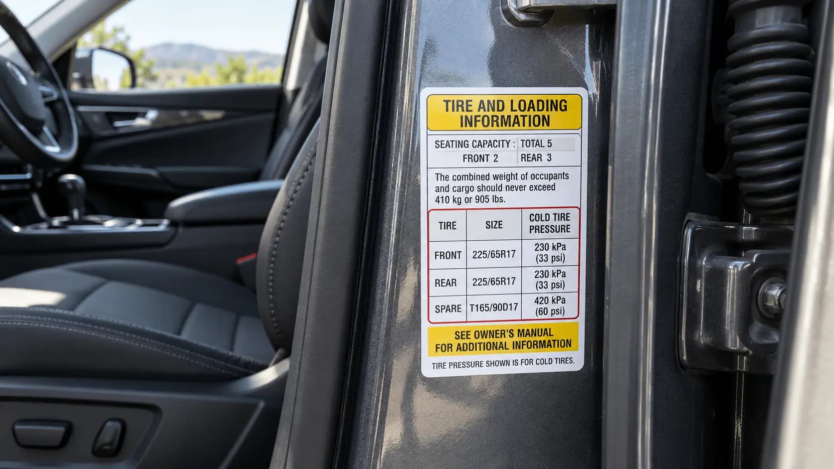 Door jamb sticker listing recommended tire size and pressure