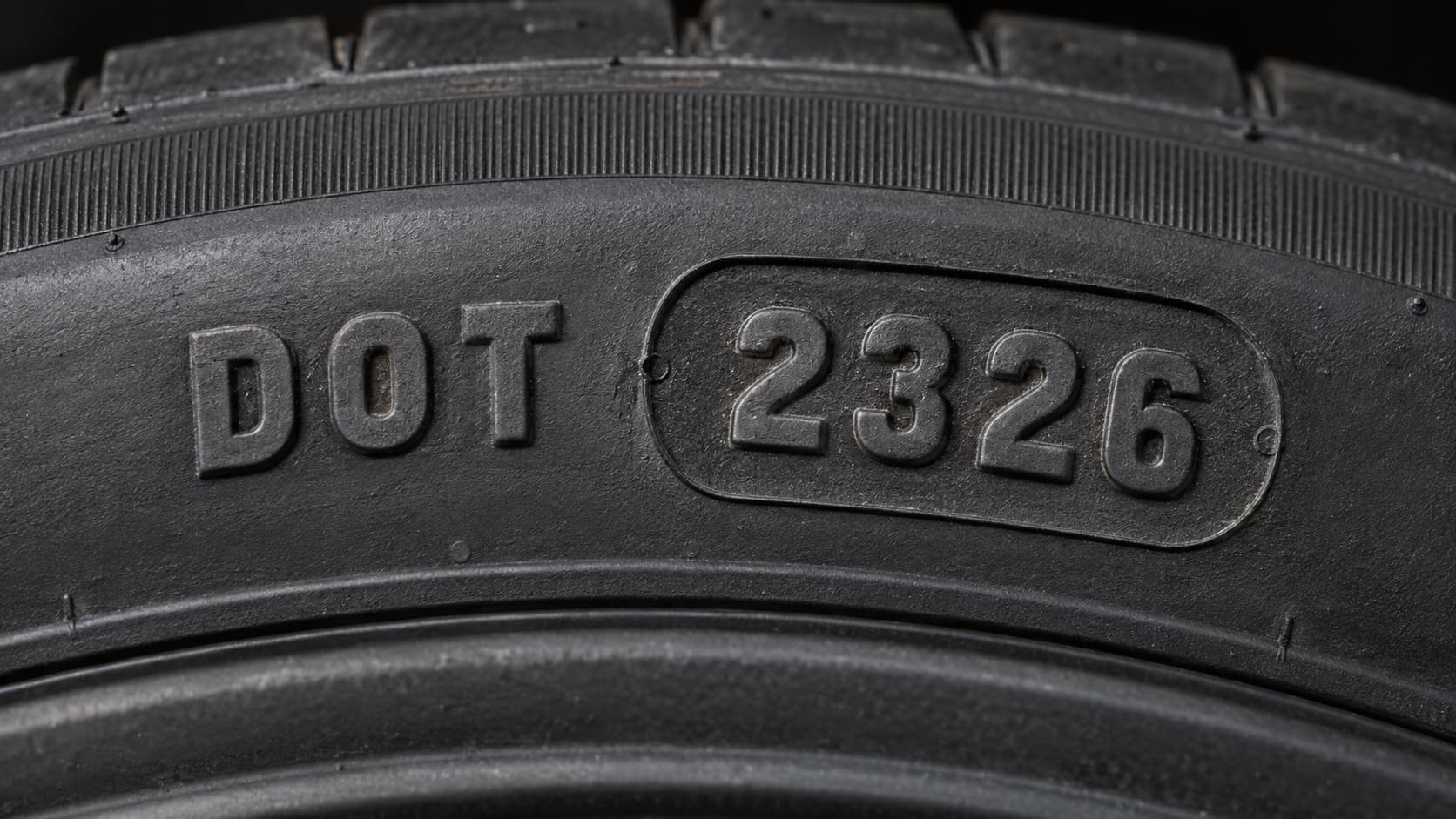 DOT code on a tire sidewall showing manufacture date 2326