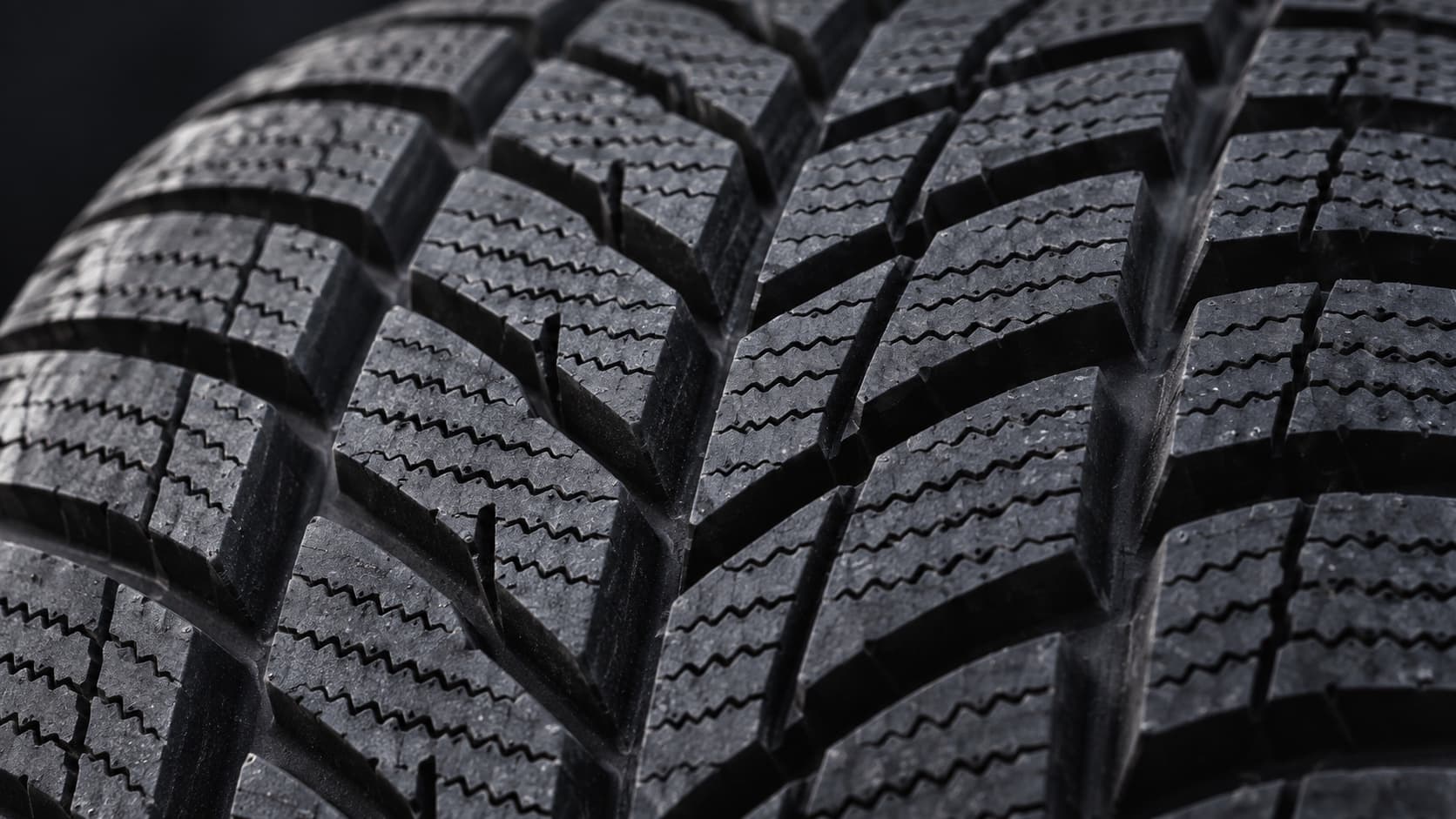 Close-up of sipes on a winter tire tread block